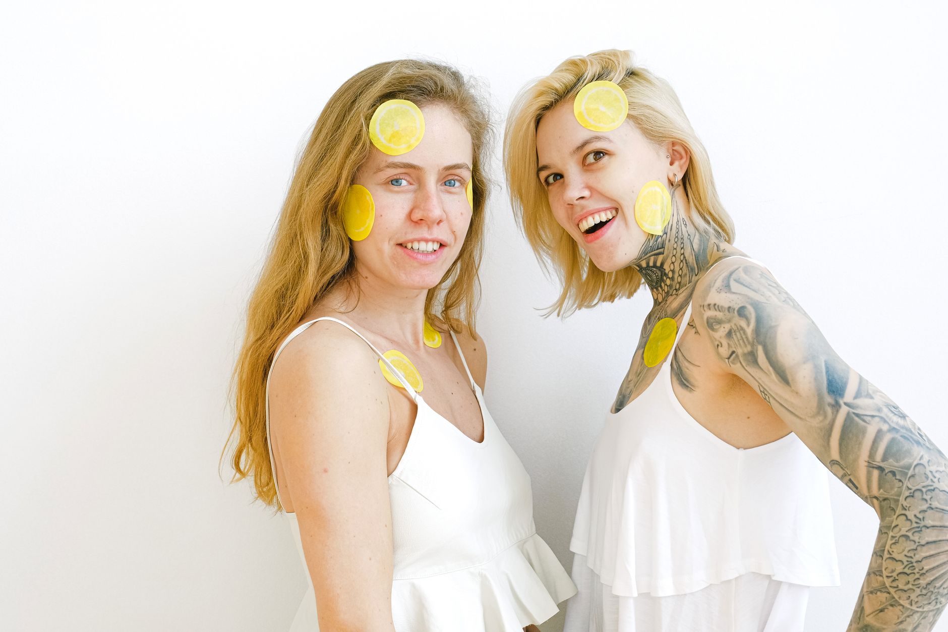 Bright yellow lemons on a pastel background, symbolizing peak sensitivity during ovulation